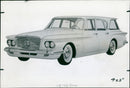 A Chrysler Valiant CQ 134 is seen on the road in October 1960. - Vintage Photograph