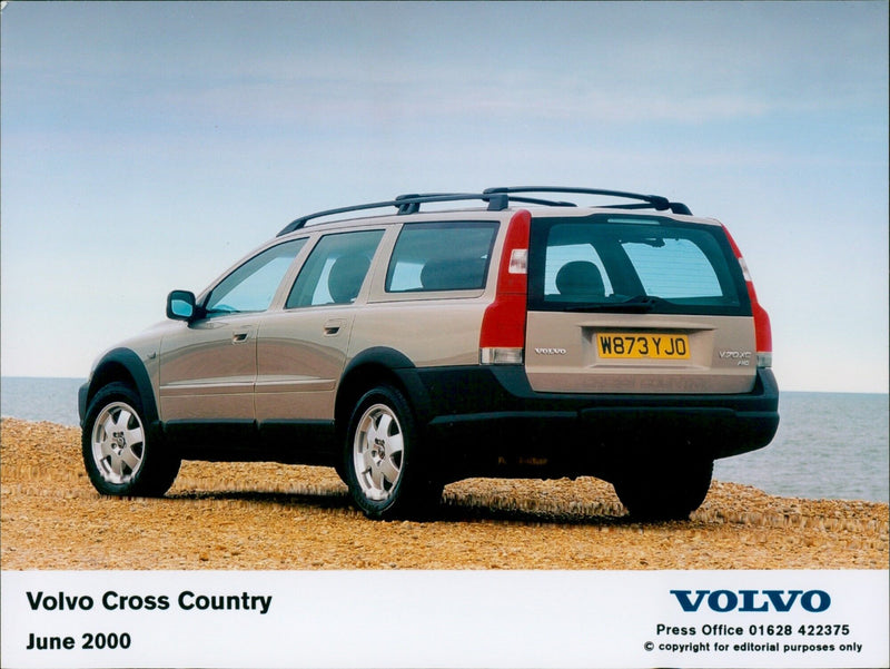 A Volvo V70XC Cross Country car is seen on the road. - Vintage Photograph