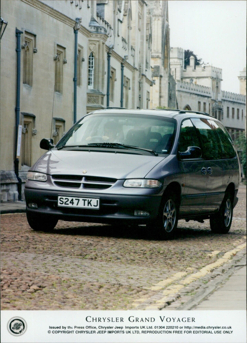 A Chrysler Grand Voyager is seen outside the Press Office of Chrysler Jeep Imports UK Ltd. - Vintage Photograph