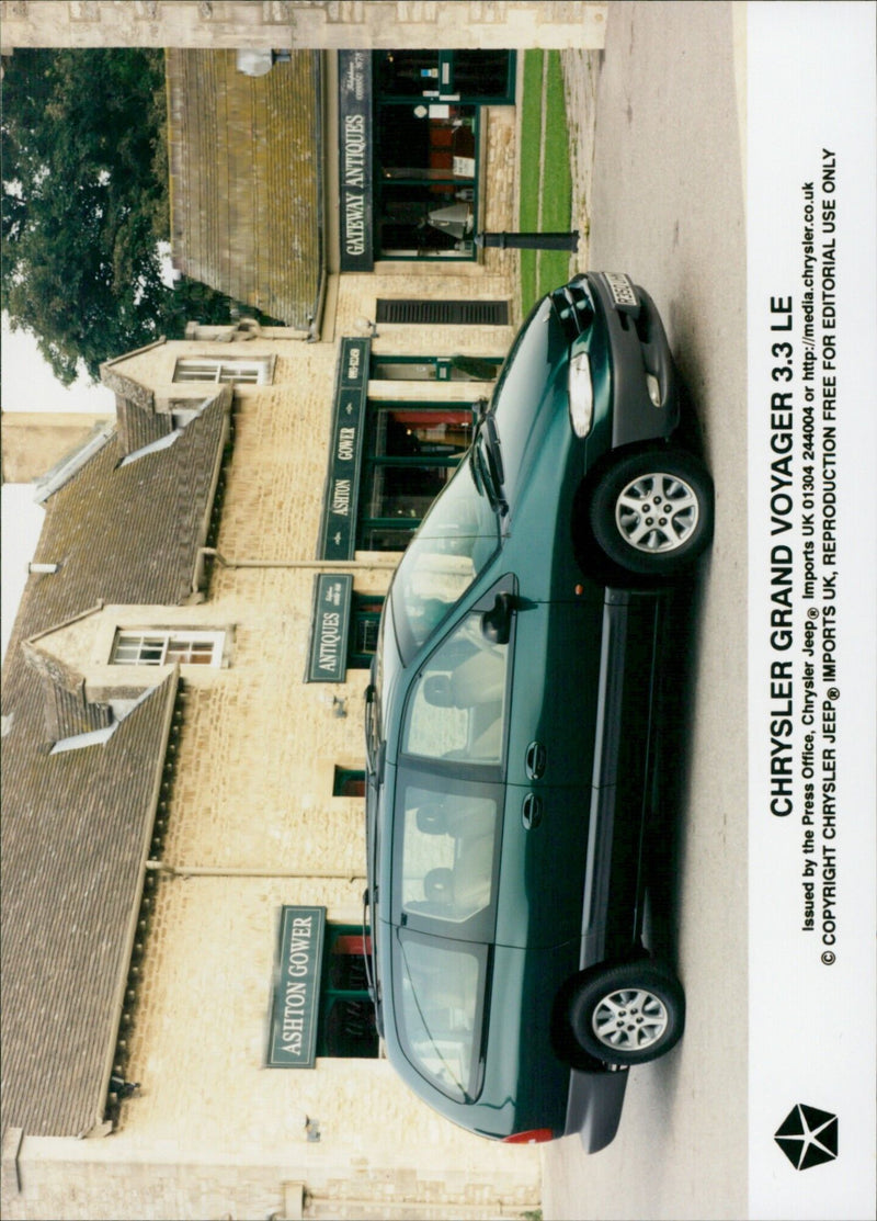 Ashton Gower Antiques is seen displaying a Chrysler Grand Voyager 3.3 LE at their store in Ashton Gower. - Vintage Photograph