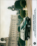 A Chrysler Grand Voyager parked on a street in the UK. - Vintage Photograph