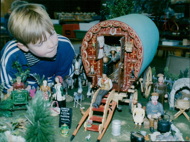 A model of a caravan built by Mo Live Sculls is part of a large farmyard display. - Vintage Photograph
