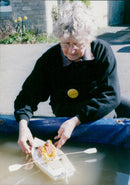 Model Jolen Davies rowing on a pond. - Vintage Photograph