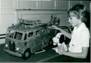 Young Christopher Webster admires a Merryweather engine model at the Mecano exhibition in Henley Town Hall. - Vintage Photograph
