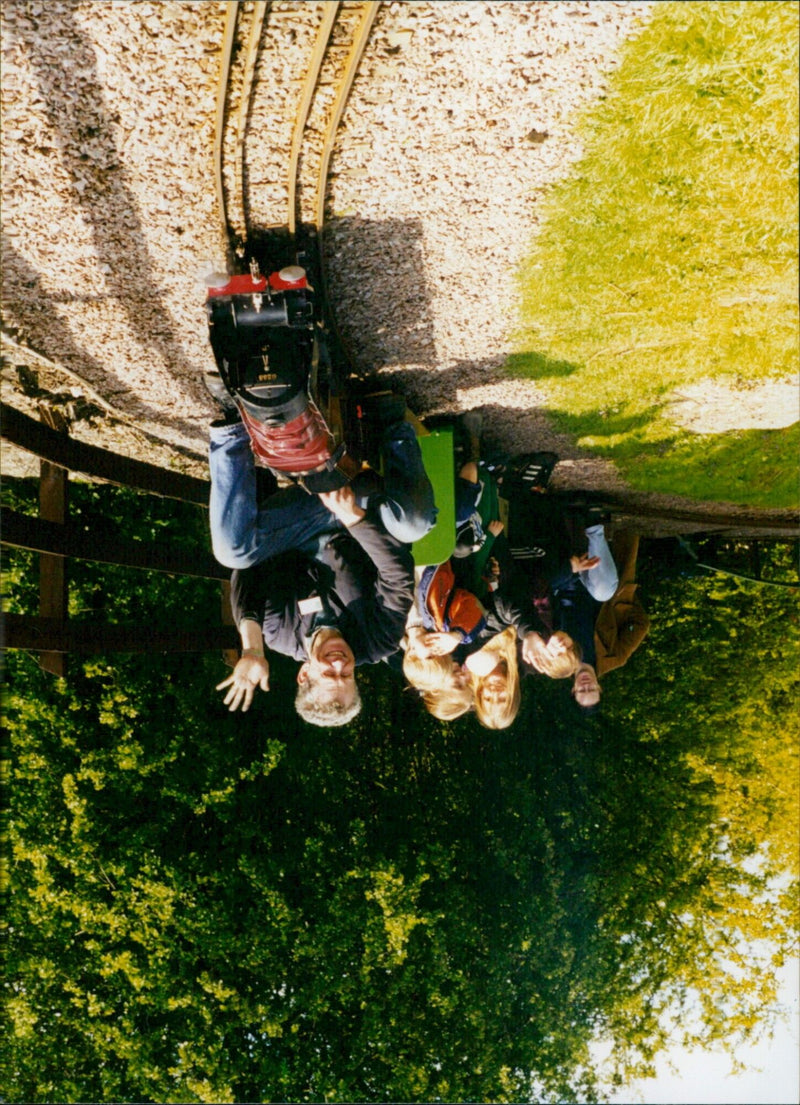 Automobile enthusiasts gather to experience the launch of the new Sezo Model X electric car. - Vintage Photograph