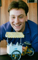 John Dykes poses with a model ice cream delivery van. - Vintage Photograph