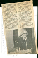 Dick Clarke of West End, Launton, poses with a matchstick model of an armoured merchantman which he made in October 1983. - Vintage Photograph