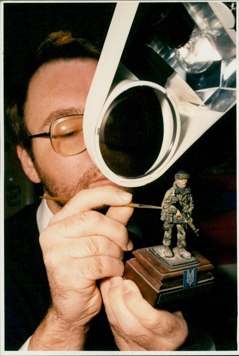 Anthony Birnie, model maker from Hitney, putting the finishing touches on a S.A.S. Most. - Vintage Photograph