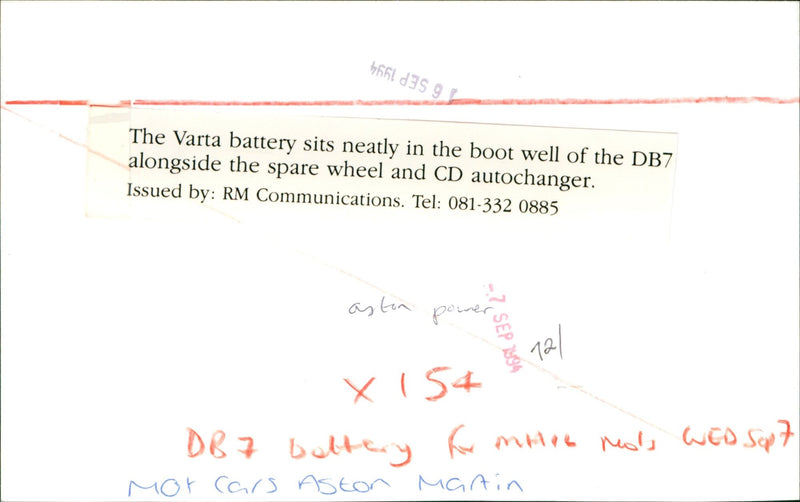 An Aston Martin DB7 with a Varta battery placed in the boot well. - Vintage Photograph
