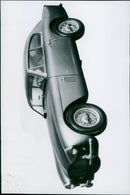 Astronauts Virgil "Gus" Grissom, John Young, and Alan Shepard pose with a model of a Mercury Spacecraft. - Vintage Photograph