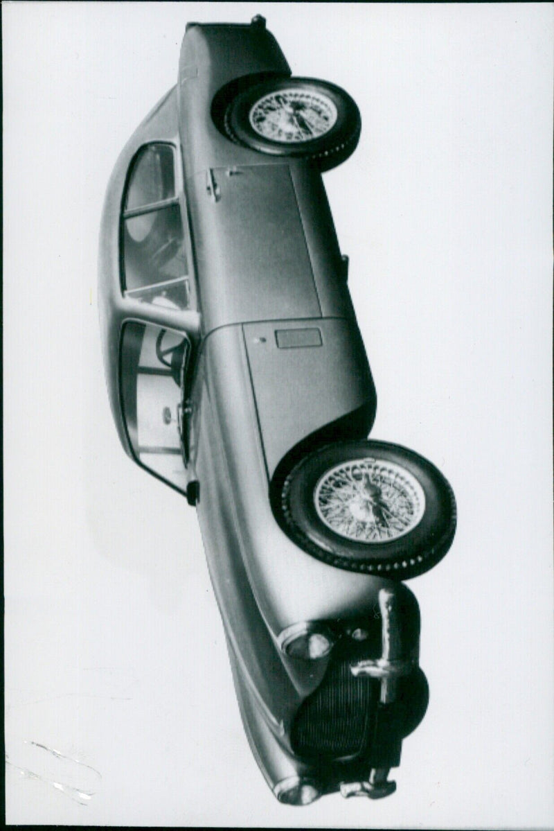 Astronauts Virgil "Gus" Grissom, John Young, and Alan Shepard pose with a model of a Mercury Spacecraft. - Vintage Photograph