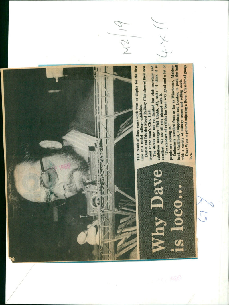 Dave Wyse, an enthusiast from the Didcot and District Model Railway Club, adjusts a Rover Class broad gauge loco at the club's exhibition in Didcot's Civic Hall. - Vintage Photograph