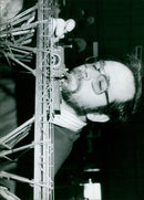 Dave Wyse, an enthusiast from the Didcot and District Model Railway Club, adjusts a Rover Class broad gauge loco at the club's exhibition in Didcot's Civic Hall. - Vintage Photograph