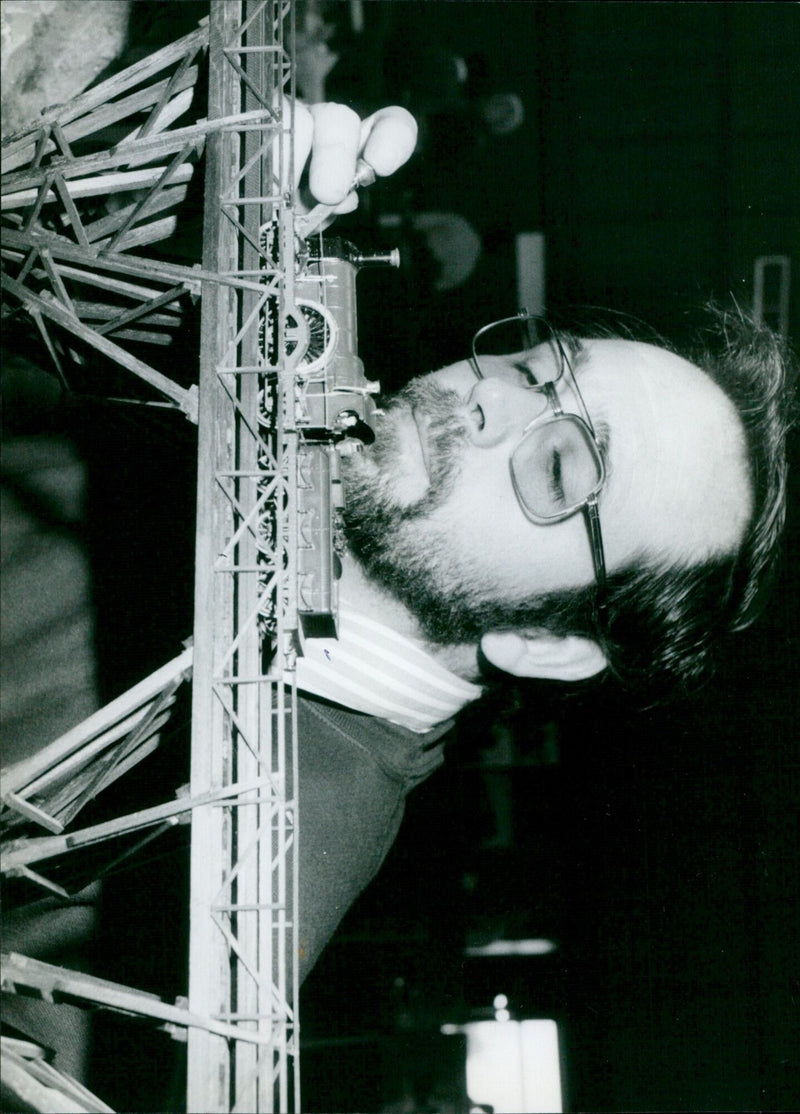 Dave Wyse, an enthusiast from the Didcot and District Model Railway Club, adjusts a Rover Class broad gauge loco at the club's exhibition in Didcot's Civic Hall. - Vintage Photograph