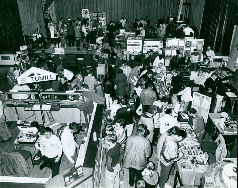 Model train enthusiasts gather to view exhibits at the Model Rail Exhibition in Abingdon. - Vintage Photograph