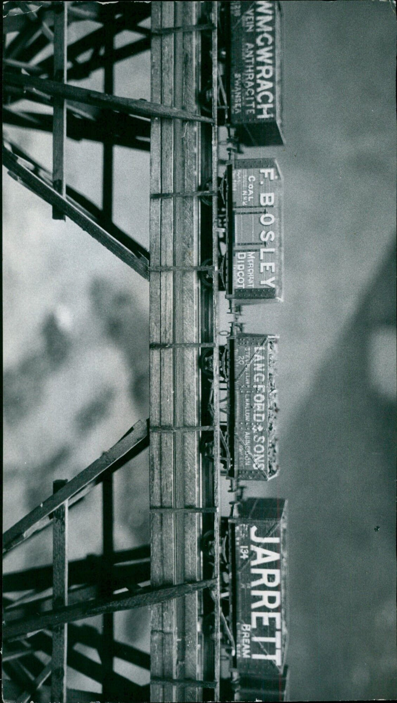 A miniature village model featuring pre-war rolling stock with local names. - Vintage Photograph