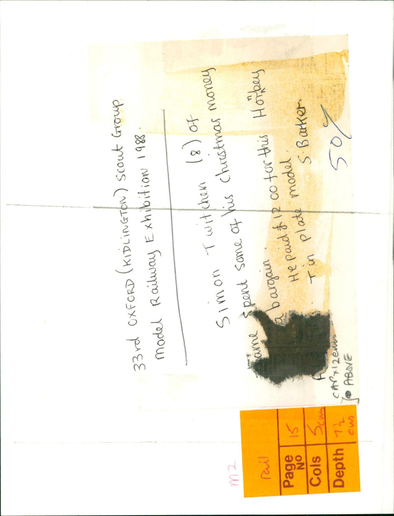 Simon Twitchen (8) inspects a model railway purchased with his Christmas money. - Vintage Photograph