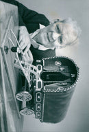 Jock Harris of Fyfield builds a model caravan. - Vintage Photograph