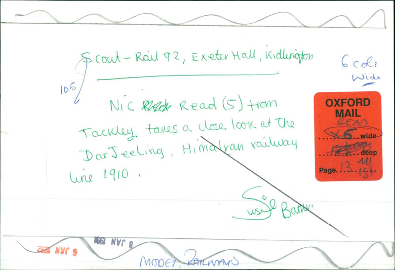 A young man examines a model of the Darjeeling Himalayan Railway Line at Exeter Hall in Kidlington, England. - Vintage Photograph