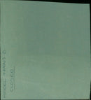 A model train set and a closed Avery Ⓡ manilla folder sit atop a wooden table. - Vintage Photograph