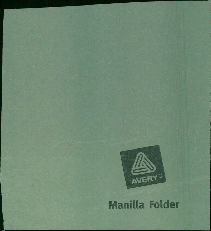 A man holds a model train set inside a closed Avery Ⓡ Manilla Folder. - Vintage Photograph