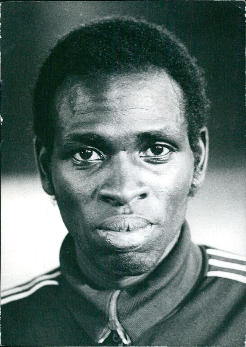 Kenyan athlete Mike Boit, one of the favourites for the gold medal in the 1976 Montreal Olympics, readies for the start of the 800m race. - Vintage Photograph