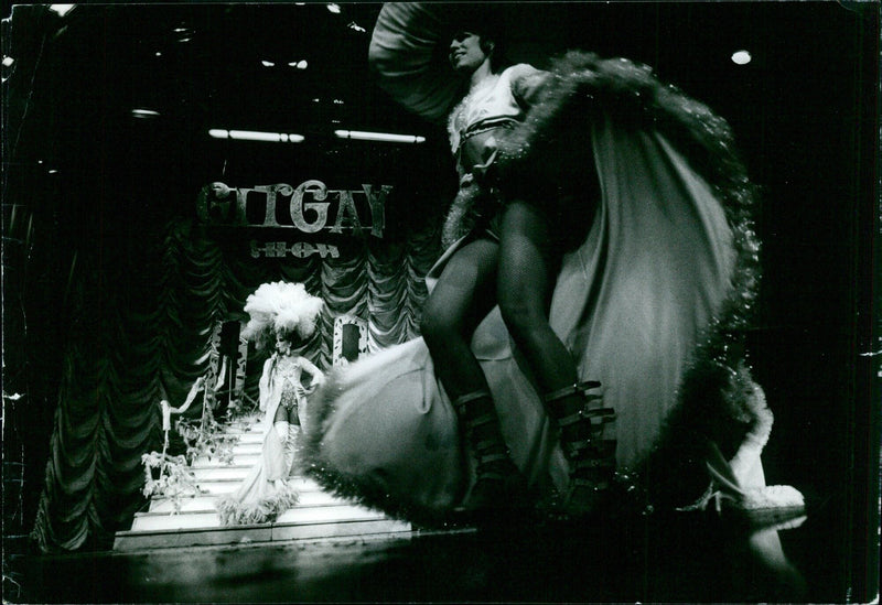 At the 10th GITGAN A 3 GIT GAY artist RTAGE-REKLAM-MODE INDUSTRI, 11 48 810GIGOLO is seen modeling the latest fashion trends. - Vintage Photograph