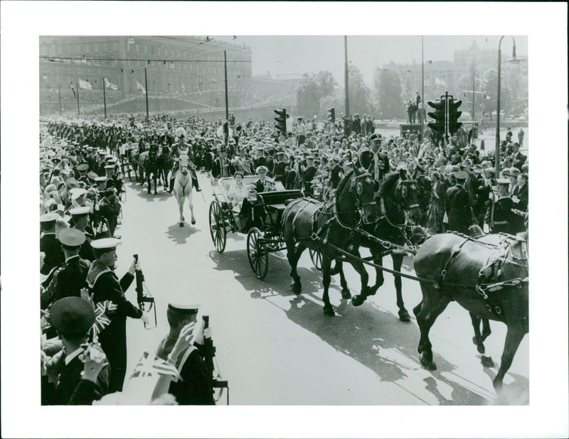 Queen Elizabeth II of England is welcomed to Sweden by King Gustaf VI Adolf during her official visit in 1956. - Vintage Photograph