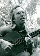 Legendary classical guitarist John Williams, born in Melbourne in 1941, is seen here performing in London in 1997. - Vintage Photograph