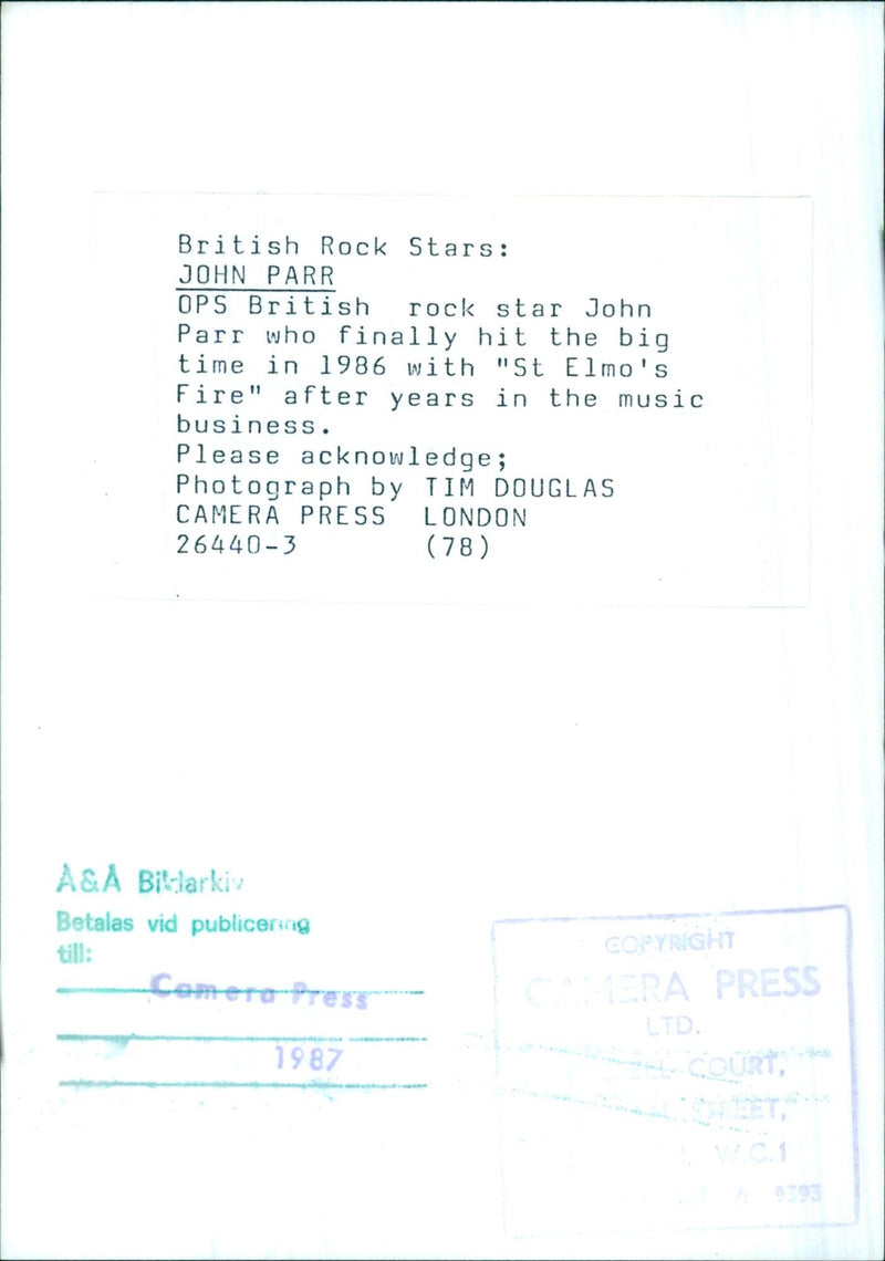 British rock star John Parr, who achieved success in 1986 with "St Elmo's Fire", is photographed in 1987. - Vintage Photograph