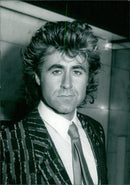 British rock star John Parr, who achieved success in 1986 with "St Elmo's Fire", is photographed in 1987. - Vintage Photograph