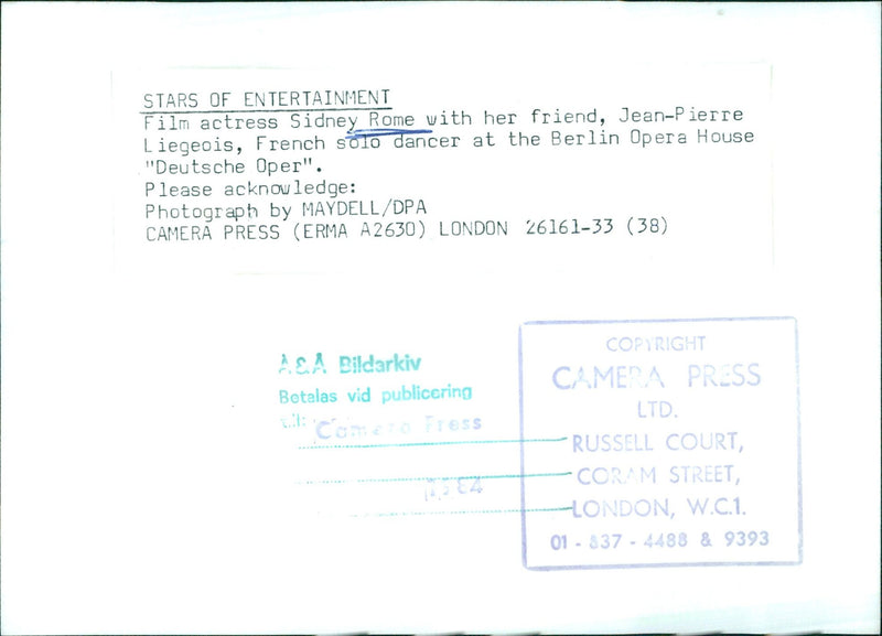 Film actress Sidney Rome poses with her friend, Jean-Pierre Liegeois, French solo dancer at the Berlin Opera House "Deutsche Oper", in a photo taken by MAYDELL/DPA CAMERA PRESS. - Vintage Photograph