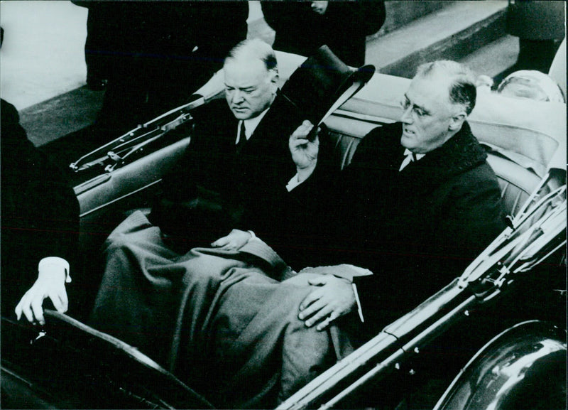 President Franklin Delano Roosevelt and Herbert Hoover take a ride in a limousine in 1936. - Vintage Photograph