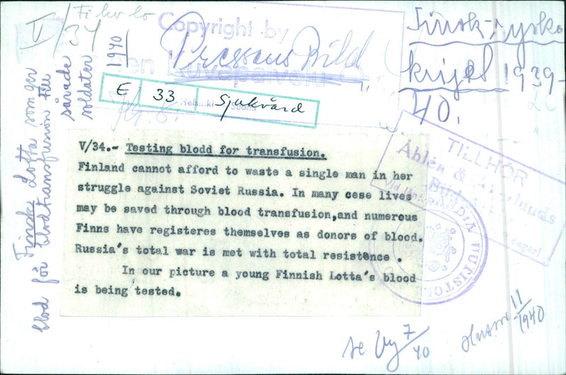 A Finnish Lotta has her blood tested in Helsinki in 1940 during Finland's struggle against the Soviet Union. - Vintage Photograph