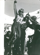 Supporters of the French presidential candidate, Isabelle Mir, cheer as she arrives in Grenoble, France on February 10, 1980. - Vintage Photograph