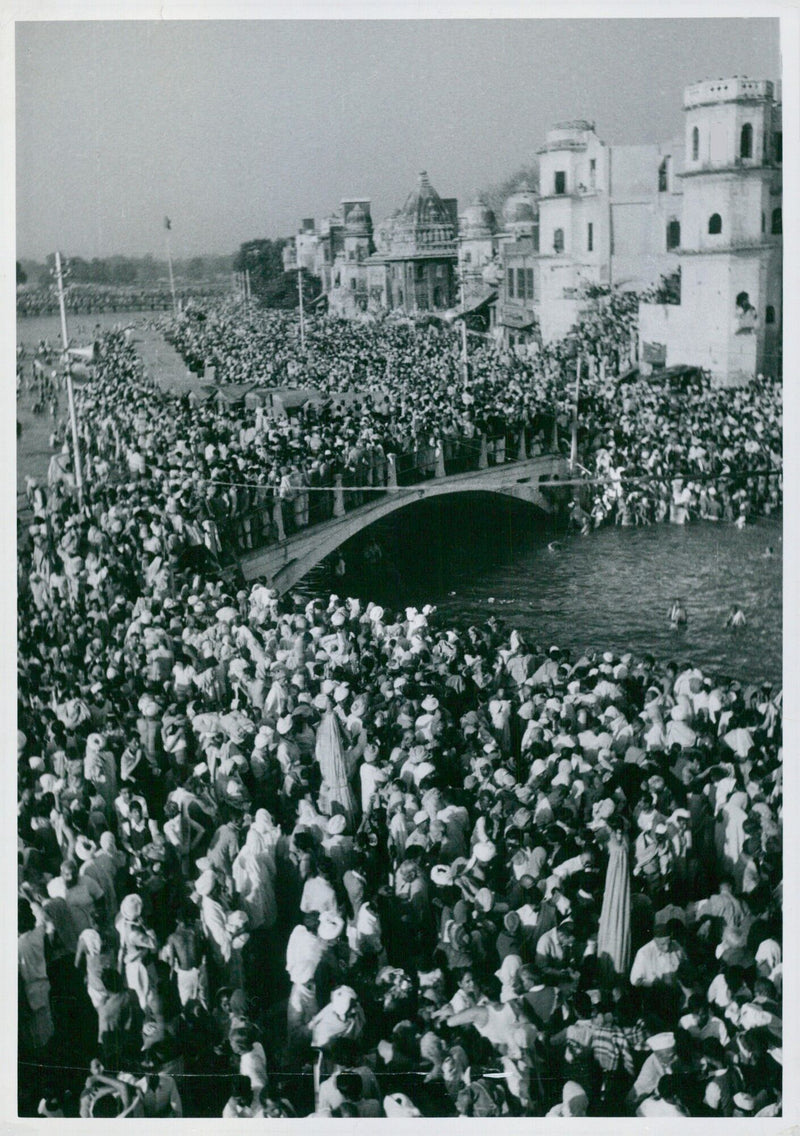 Thousands of spectators witnessed Indian pioneers crossing the holy river on bridges, surrounded by the majestic landscape in Tockholm, Sweden. - Vintage Photograph