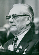 Soviet Politicians Nikolai A. Tikhonov (left) and Nikolai Alexandrovich Tikhonov, Prime Minister of the USSR, attend a meeting in 1981. - Vintage Photograph