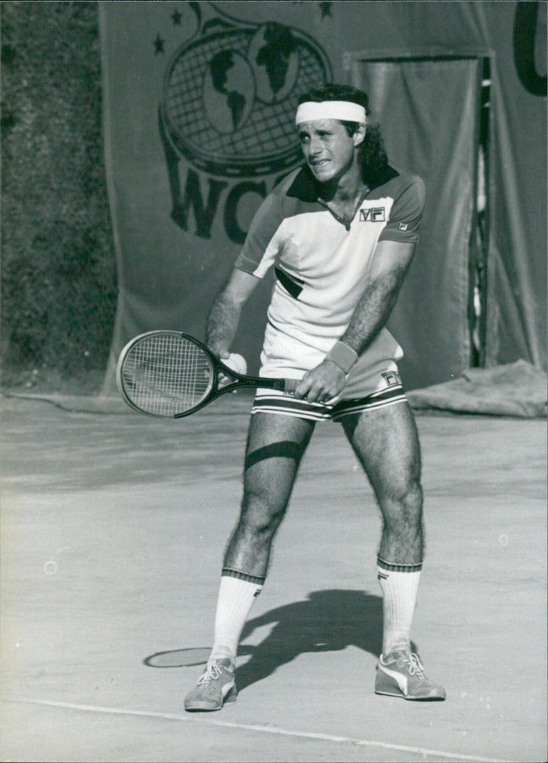 Argentinian tennis star Guillermo Vilas takes part in a match. - Vintage Photograph