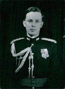 Captain Peter Harvey is seen here at Buckingham Palace, London, preparing to accompany Her Majesty Queen Elizabeth II on a royal visit to India and Pakistan. - Vintage Photograph