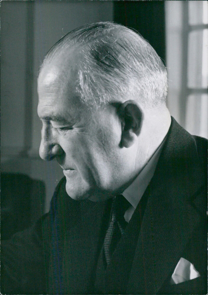 Lord Percy Herbert Mills, K.B.E., P.C., Ist Baron Milis, the Minister of Power since January 1957, poses for a photo in Sveavägth 3, Stockholm, Sweden. - Vintage Photograph