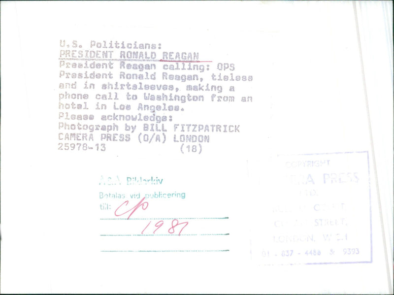 President Ronald Reagan making a phone call from an hotel in Los Angeles while tieless and in shirtsleeves. - Vintage Photograph