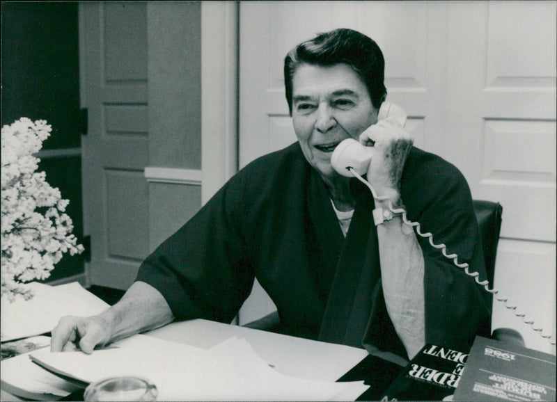 President Ronald Reagan speaks from his hospital room at the Bethesda Naval Hospital in Washington, shortly after undergoing a prostate operation. - Vintage Photograph