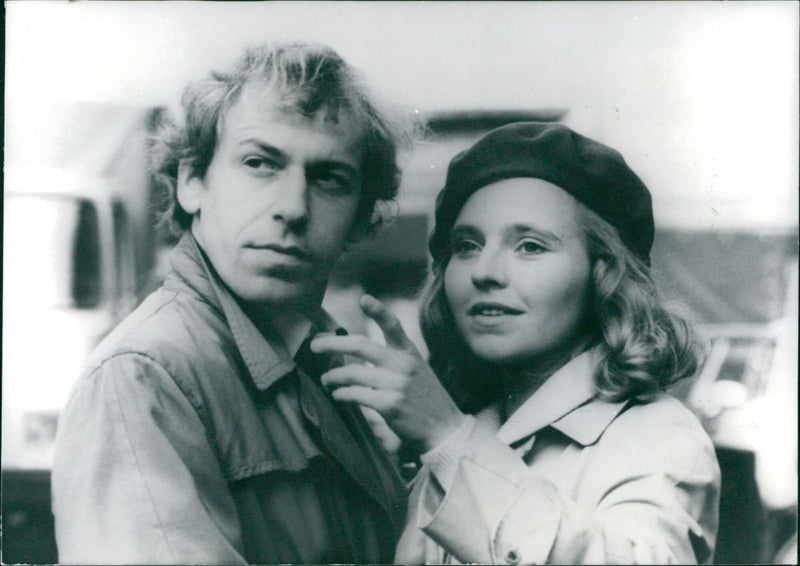 West German actors Rudiger Vogler and Hanna Schygulla, stars of the 1975 Federal Film Prize-winning movie "Falsche Bewegung," pose for a photo. - Vintage Photograph