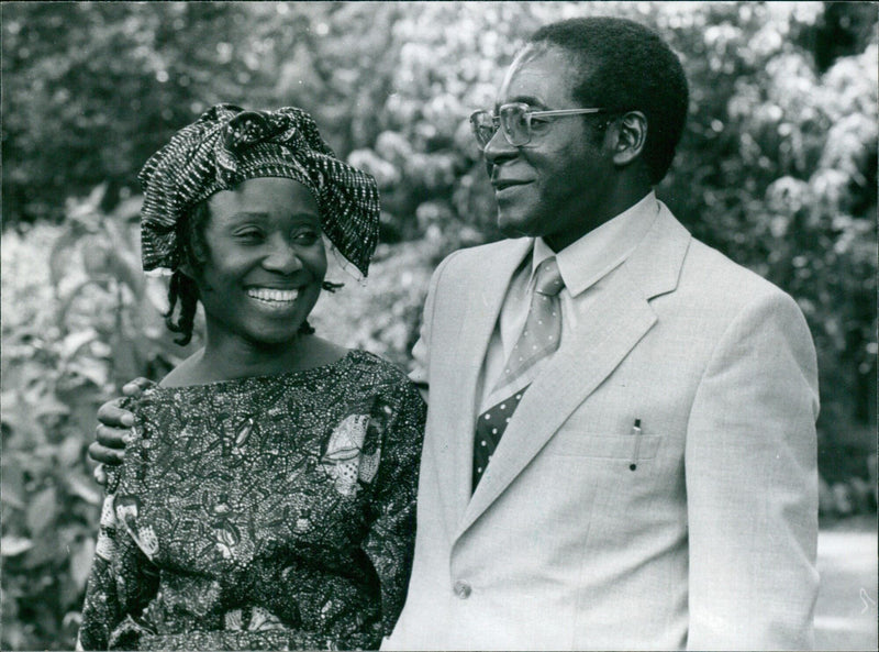 Zimbabwean Prime Minister-designate Robert Mugabe and his wife Sally pose for a photo in 1980. - Vintage Photograph