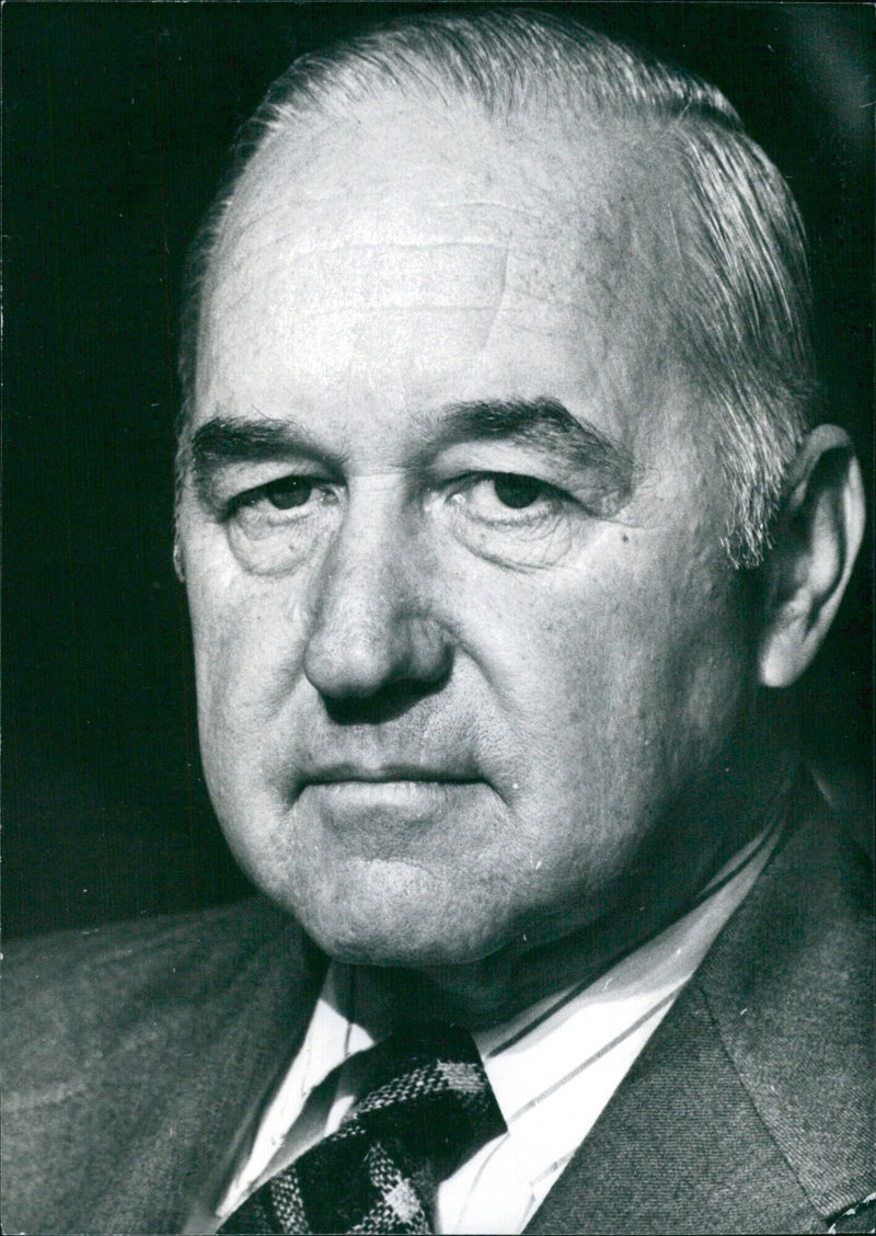 Governor of the State of New Hampshire, Meldrim Thomson Jnr., speaks with members of the press during a press conference on July 17, 1975. - Vintage Photograph