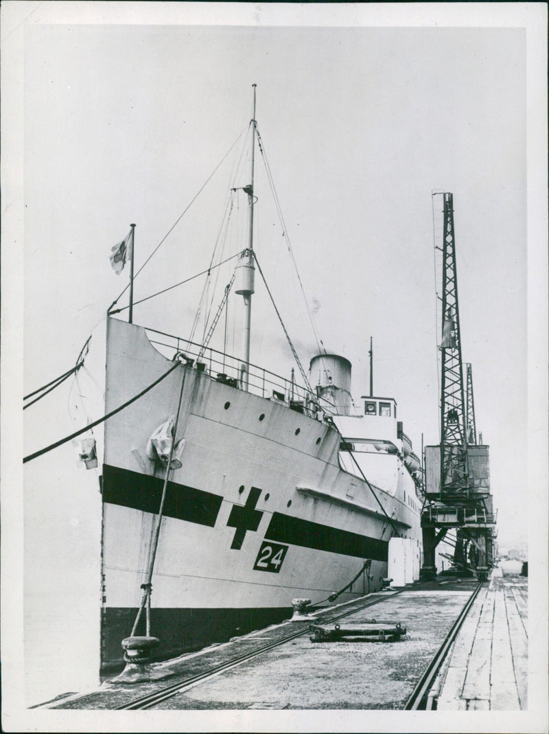 A hospital ship, painted with the Red Cross, lies at a London quayside and is ready to receive casualties in preparation for possible air-raids in 1948. - Vintage Photograph