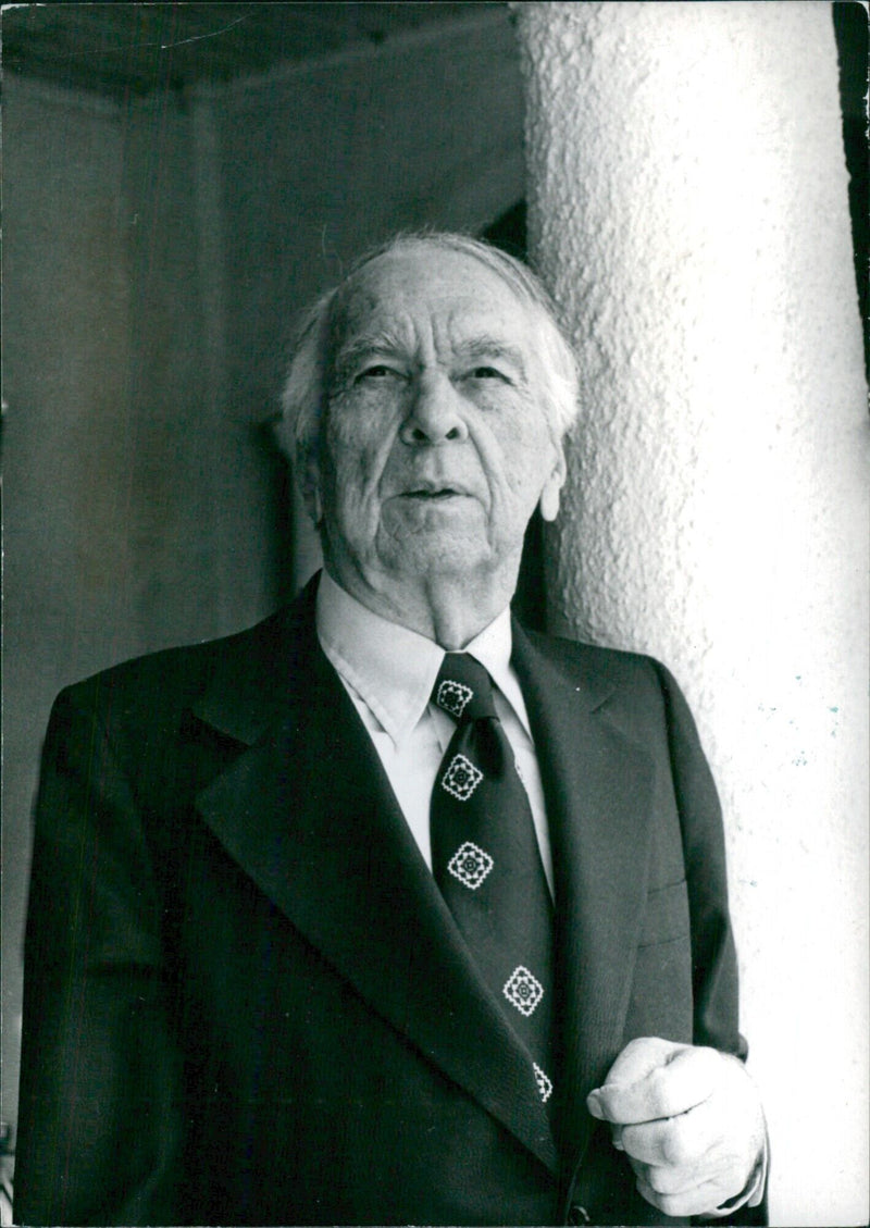 Internationally-renowned American astrologer Carroll R.B. Righter stands in his Hollywood home. - Vintage Photograph