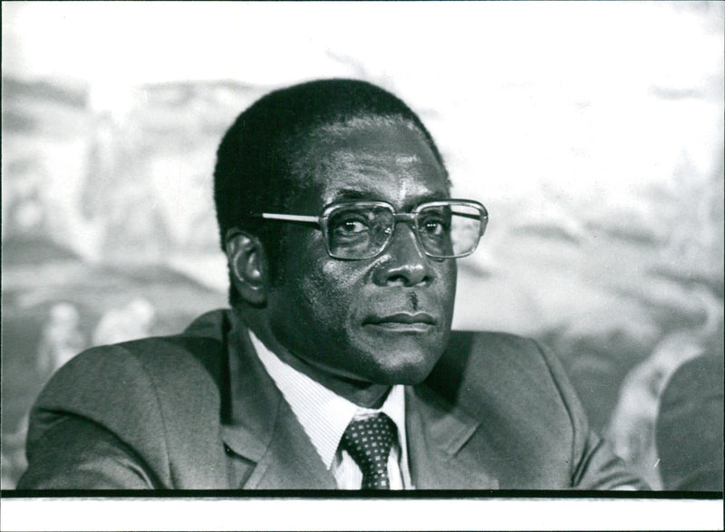 Zimbabwe Prime Minister Robert Mugabe poses for a picture in 1987, alongside Zimbabwe African National Union (ZANU) co-founder Joshua Nkomo. - Vintage Photograph