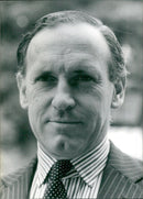 William Heseltine, Queen Elizabeth II's Deputy Private Secretary since 1977, is pictured at his office in London, England in July 1978. - Vintage Photograph