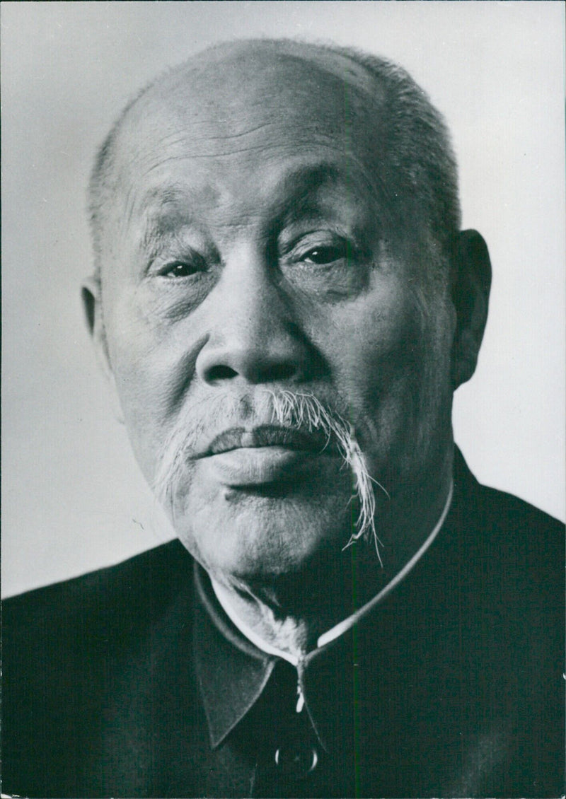 Vice-Chairman of the Standing Committee of the National People's Council, Tung Pi-wu, is pictured in a 1975 photograph taken in a London street. - Vintage Photograph